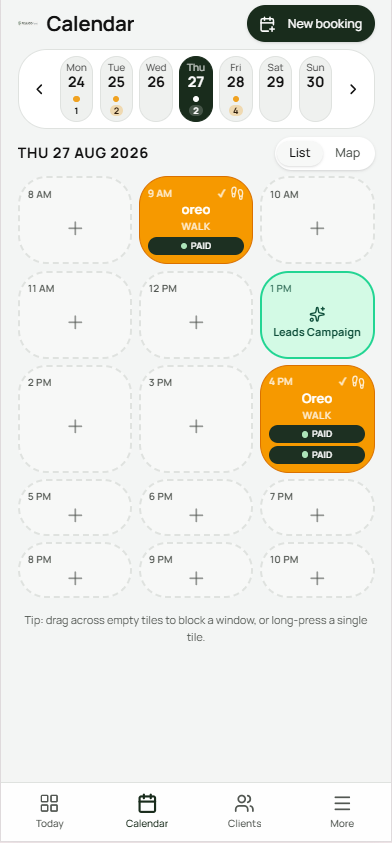 Felligo calendar day view showing walk bookings with PAID status badges